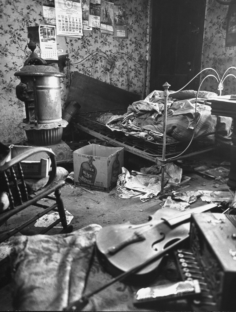 The filthy, cluttered bedroom in Ed Gein's Plainfield, Wis., home, 1957.