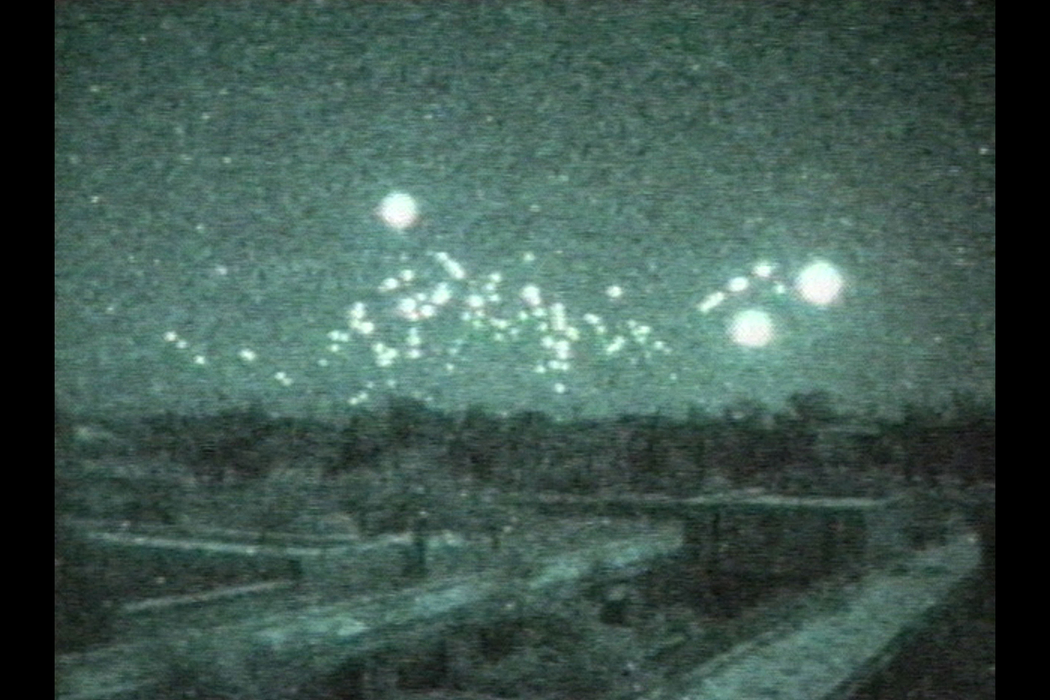 This image taken from a low-light video camera shows tracer-fire from antiaircraft guns on February 22, 1991 in Baghdad, Iraq. The video was shot from the hotel room of CNN correspondents who remained in Baghdad during the Gulf War.