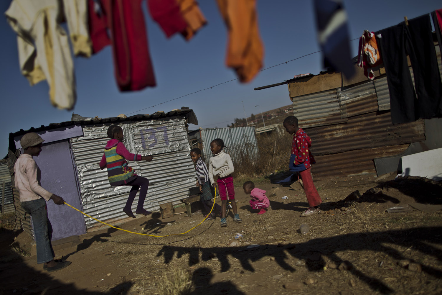 July 1, 2013. A group of South African girls enjoy skipping a rope in Soweto township, on the outskirts of Johannesburg, South Africa.