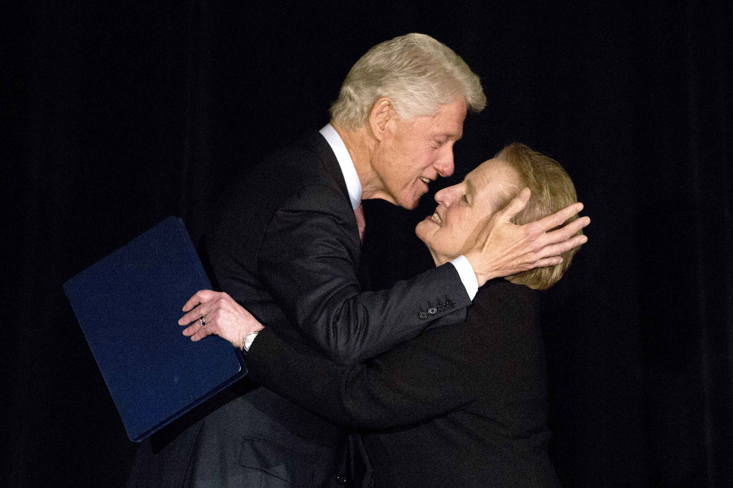 Former U.S. President Bill Clinton greets Former Secretary of State Madeleine Albright on stage at the Annual Freedom Award Benefit Event hosted by the International Rescue Committee at the Waldorf-Astoria in New York