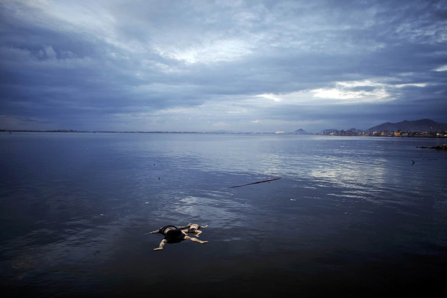 Nov. 16, 2013. Bodies of a woman and a child, victims of Typhoon Haiyan, float at sea near Tacloban.