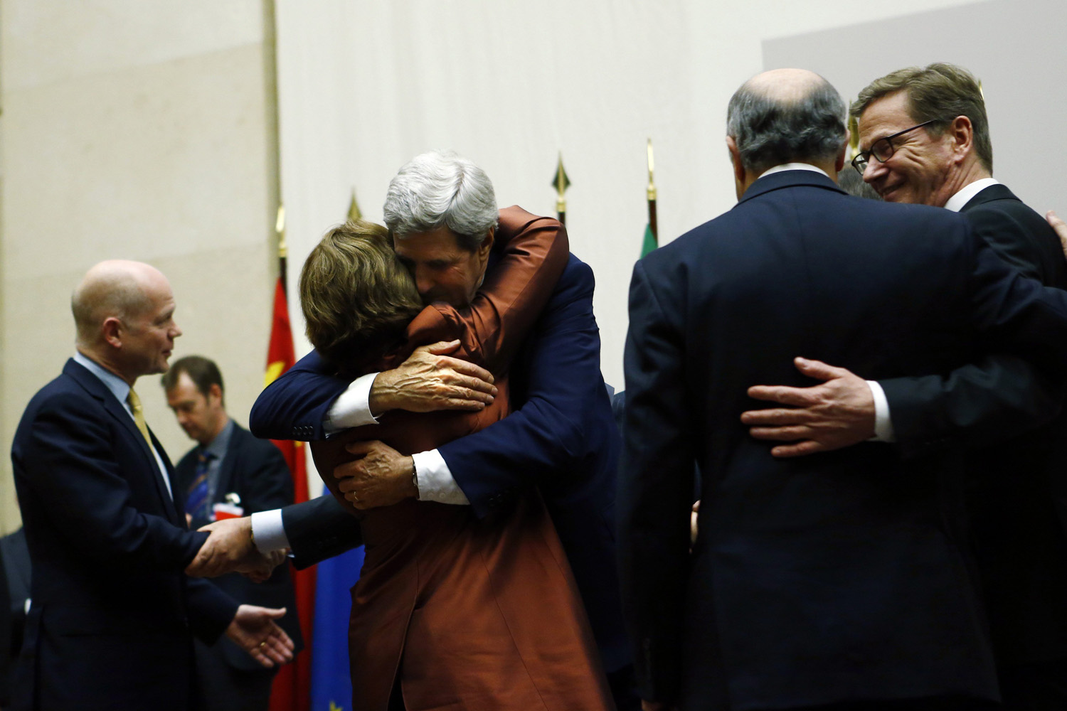 Nov. 24, 2013. U.S. Secretary of State John Kerry (3rd R) hugs European Union foreign policy chief Catherine Ashton after she delivered a statement during a ceremony next to British Foreign Secretary William Hague (L), Germany's Foreign Minister Guido Westerwelle (R) and French Foreign Affairs Minister Laurent Fabius at the United Nations in Geneva.
