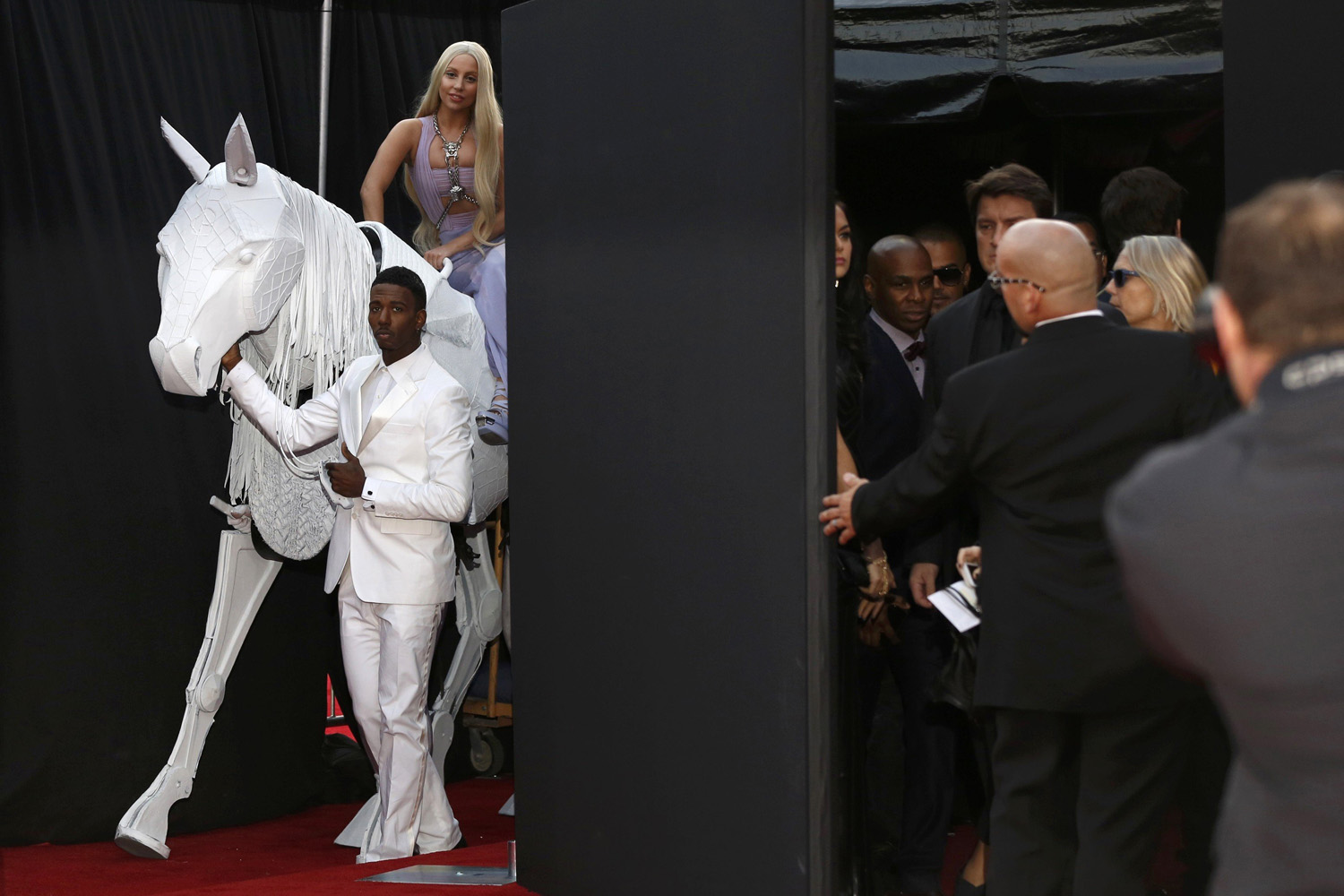 Nov. 24, 2013. Musician Lady Gaga arrives atop a horse puppet at the 41st American Music Awards in Los Angeles, Calif.