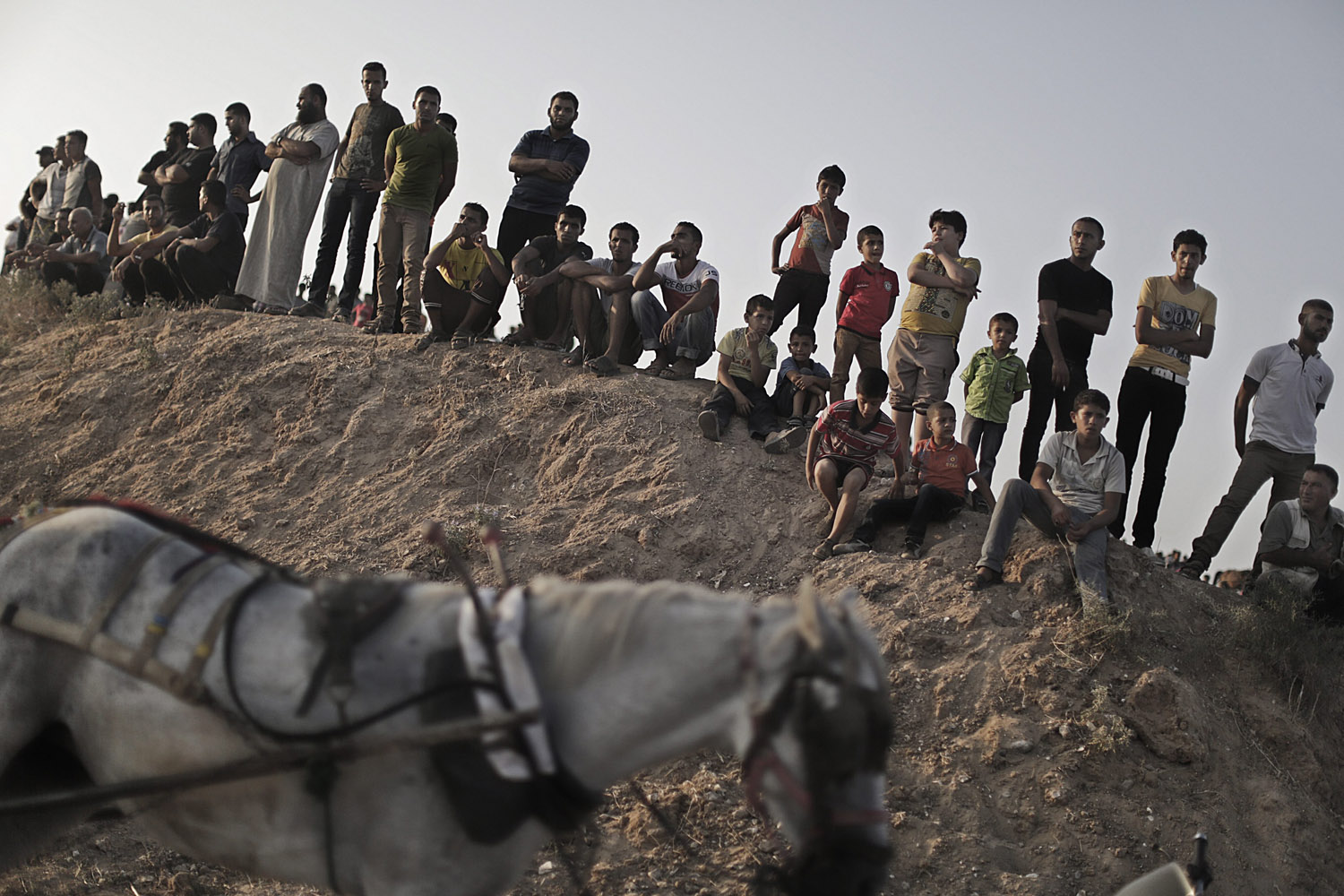 Sept. 1, 2013. Palestinian spectators attend a horse race and show in the North of the Gaza Strip.