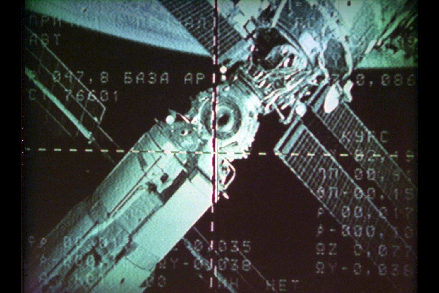 A TV screen at the Mission Control Center at Korolyov, Russia shows the docking camera of the International Space Station from the Soyuz TM-32 vessel, April 30, 2001.