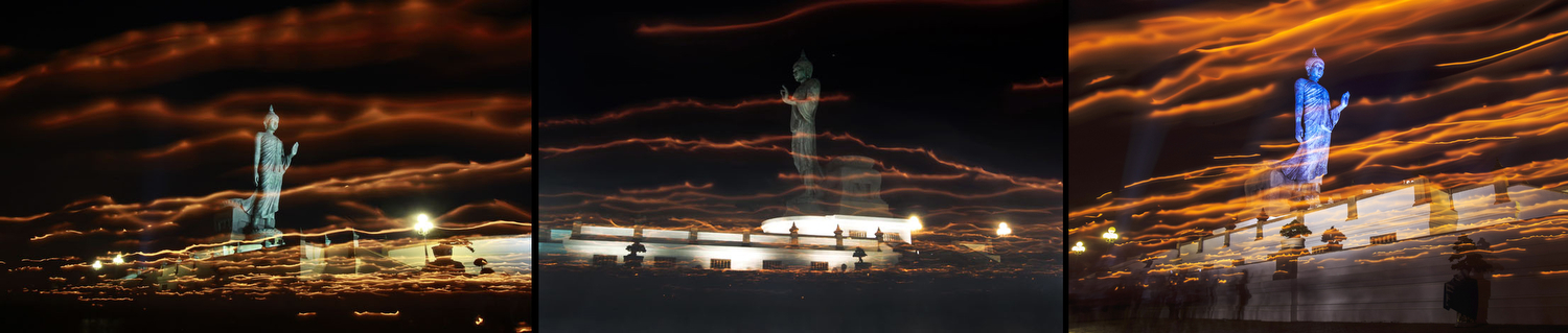 Buddhist devotees carry candles while encircling a large Buddha statue is seen in this long exposure photograph during Vesak Day