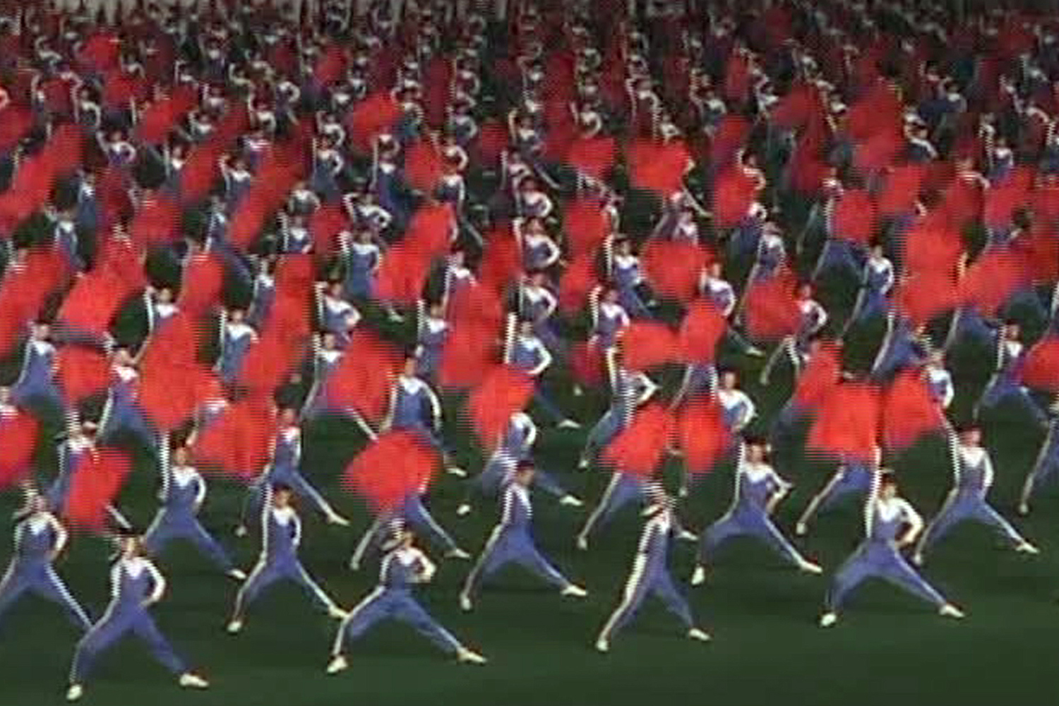 In this image taken from a video footage shot by APTN, a group of dancers performs as part of Arirang festival in Pyongyang, North Korea, Monday, Aug. 10, 2009.
