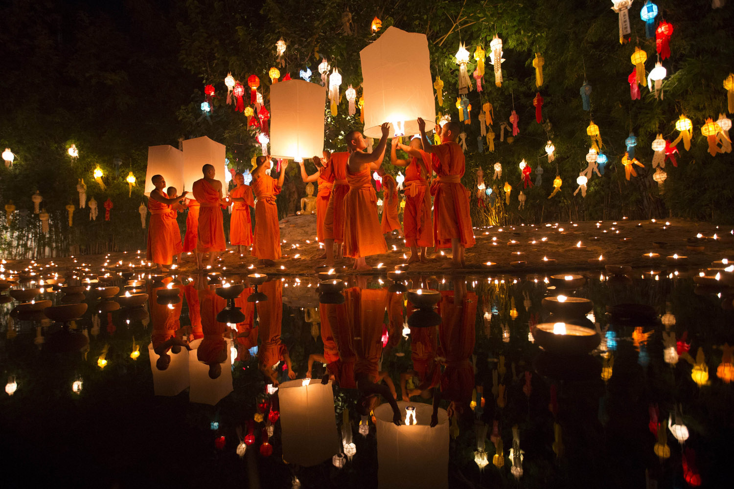 Nov. 17, 2013. Buddhist monks prepare to release sky lantern after a blessing ceremony during the Loy Krathong Festival at a temple in Chiang Mai, Thailand.
