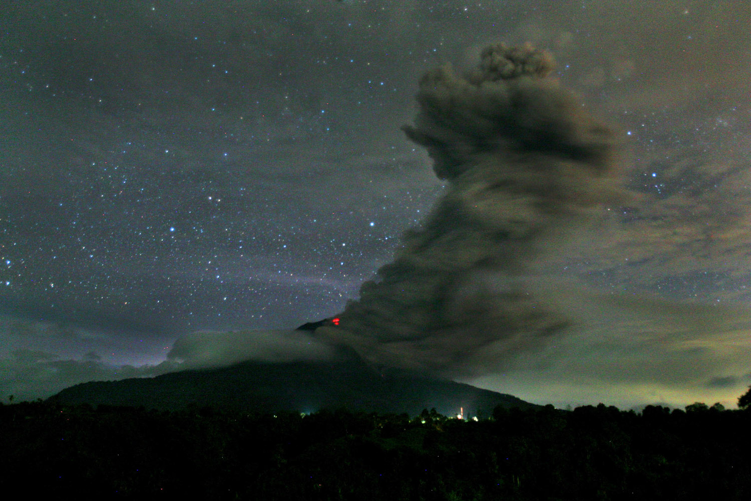 Nov. 24, 2013. Mount Sinabung spews volcanic ash into the air as seen from Tiga Pancur, North Sumatra, Indonesia.