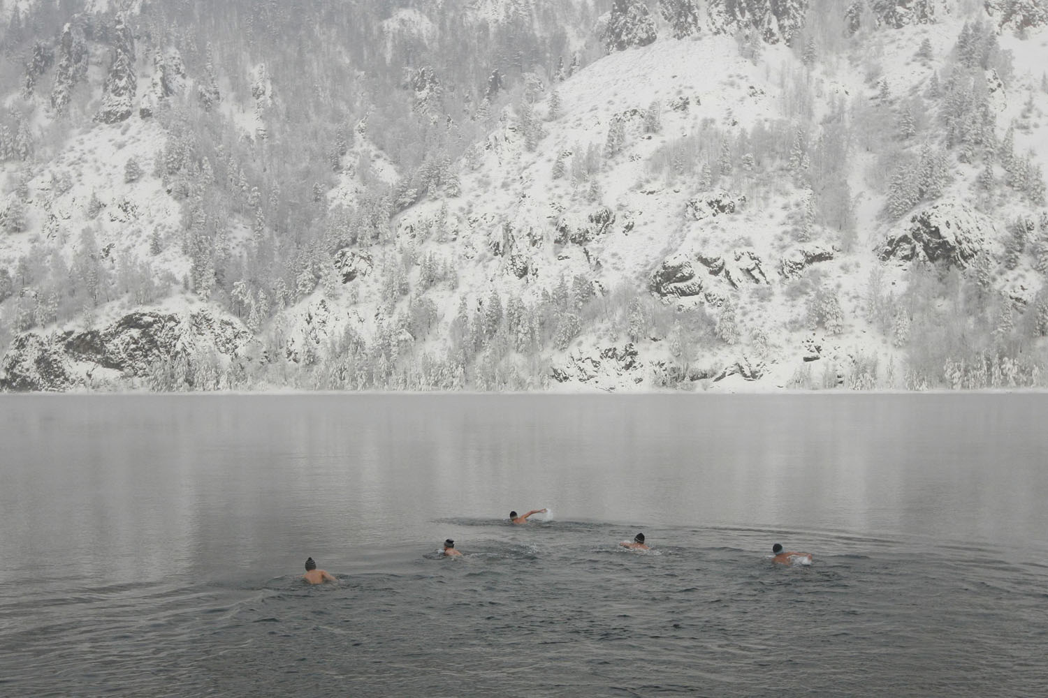 Members of a local winter swimming club take part in their weekly bath in the Yenisei River, while air temperatures stand at minus 17 degrees Celsius, in town of Divnogorsk