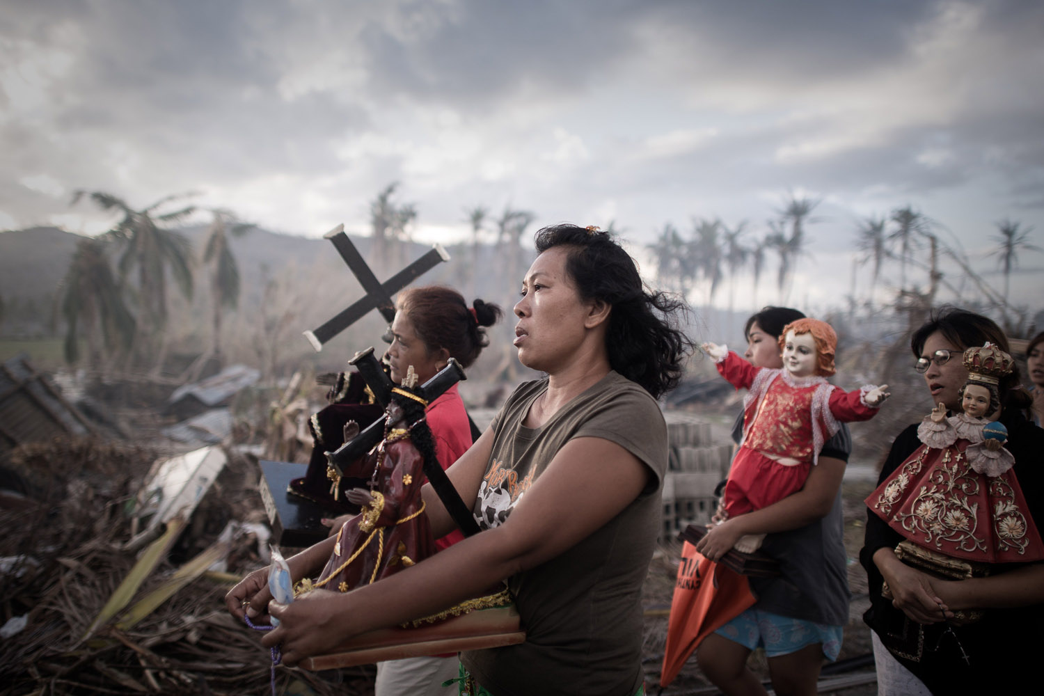 Nov. 18, 2013. Survivors of Super Typhoon Haiyan march during a religious procession in Tolosa on the eastern Philippine island of Leyte over one week after Super Typhoon Haiyan devastated the area.