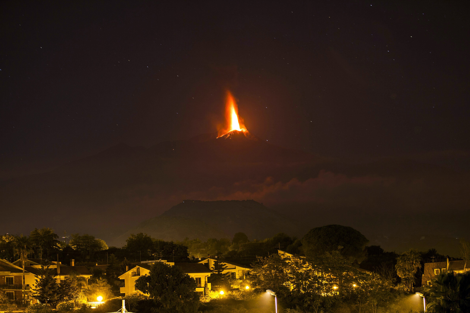 Oct. 26, 2013. Lava flows during an eruption of Mount Etna volcano as seen from the village of Viagrande, near the Sicilian town of Catania, Italy.