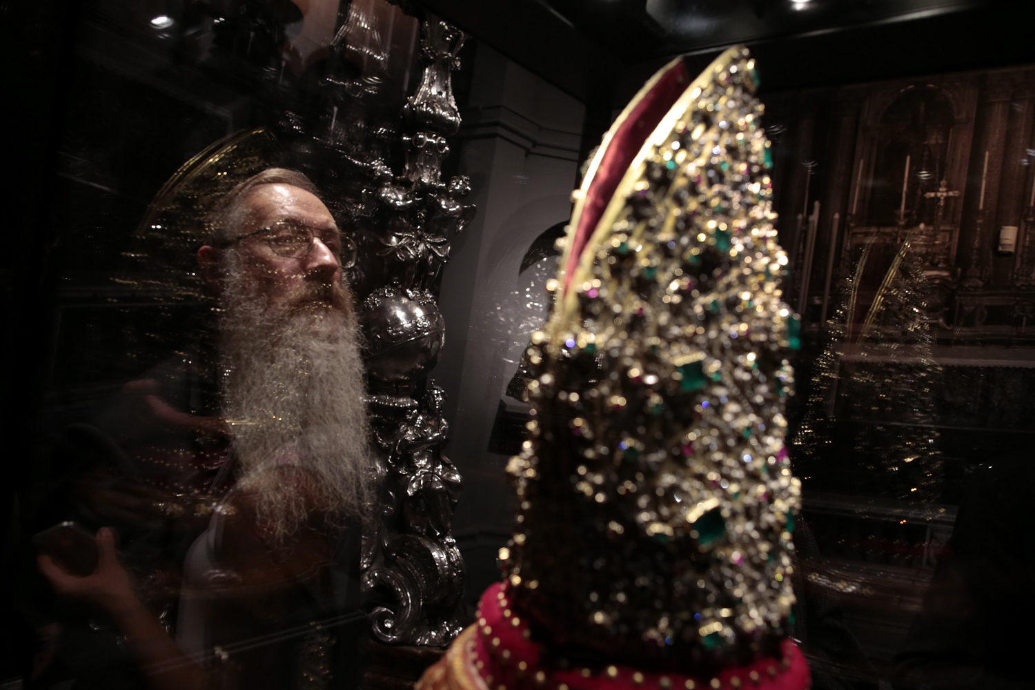 Visitor looks at the Mitre of San Gennaro during an exhibition in Rome