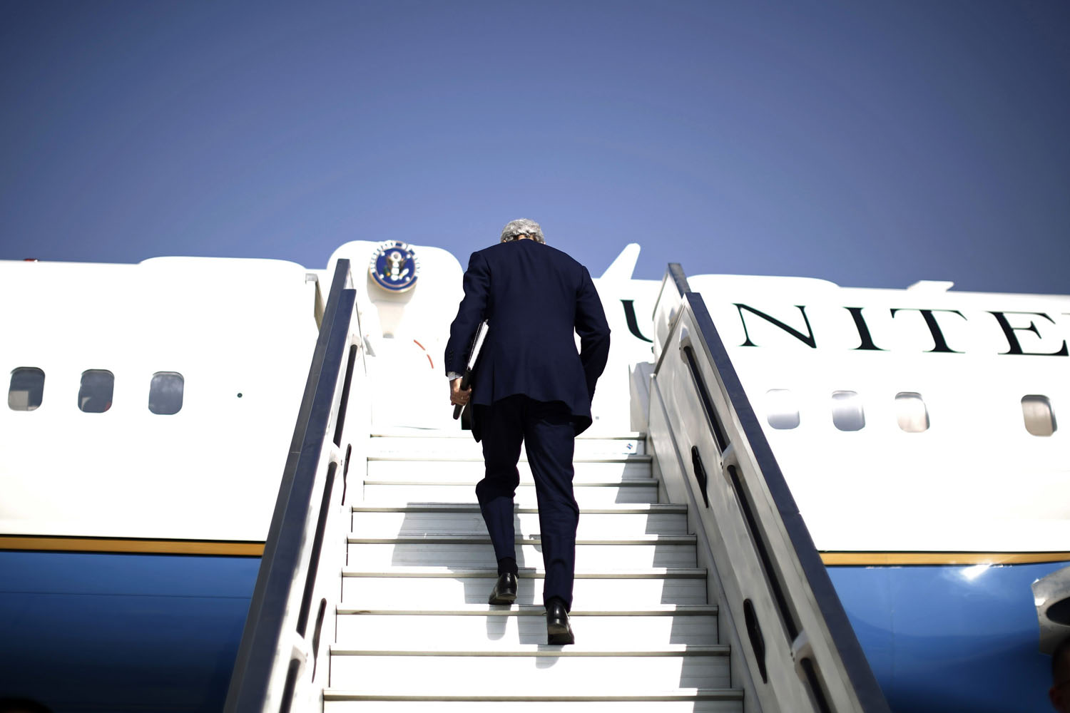 U.S. Secretary of State John Kerry steps aboard his aircraft in Tel Aviv