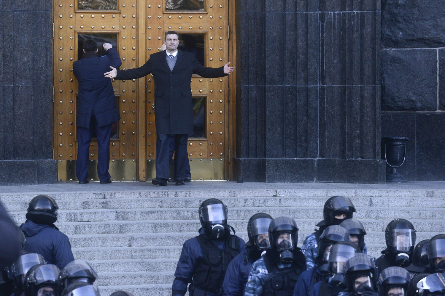 Nov. 27, 2013. Oleh Tyahnybok, left, leader of the of nationalist Svoboda (Freedom) party tries to open the door to Cabinet of Ministers as lawmaker and chairman of the Ukrainian opposition party Udar (Punch), WBC heavyweight boxing champion Vitali Klitschko, right, raises his arm to indicate that the door is closed  during a rally in front of the Ukrainian Cabinet of Ministers in Kiev, Ukraine.