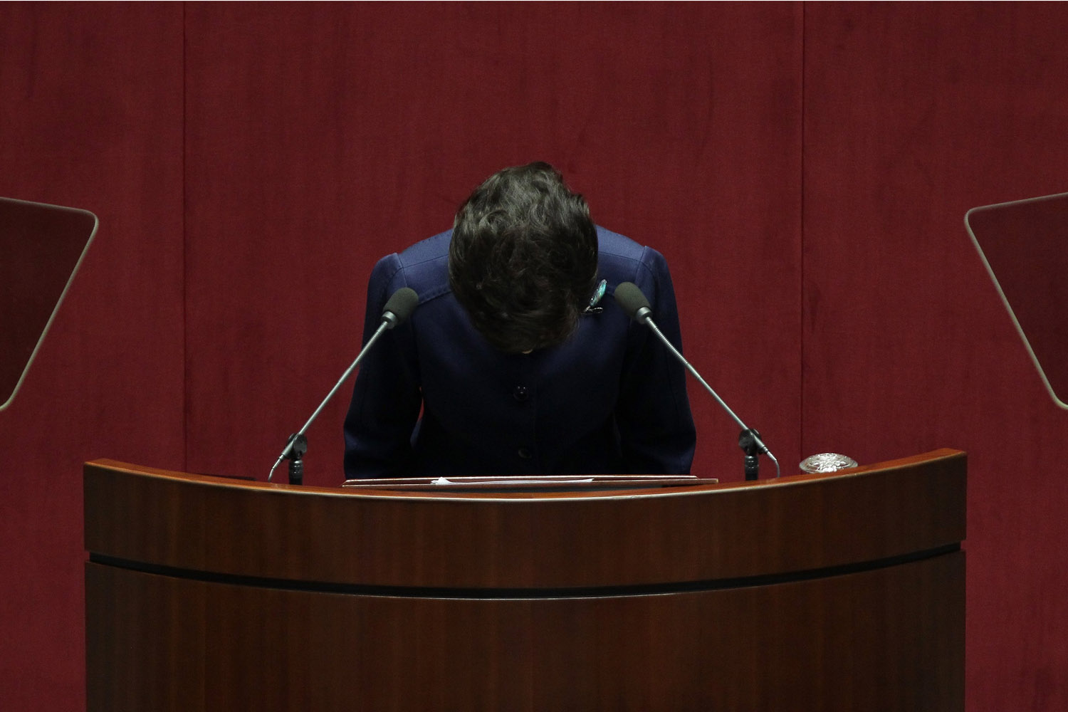 November 18, 2013. South Korean President Park Geun-Hye bows her head as speaks at the National Assembly in Seoul, South Korea. President Park Geun-Hye today announced that she would  respect and accept  her rival parties agreement after the allegations that state agencies attempted to tamper with last year's presidential race.