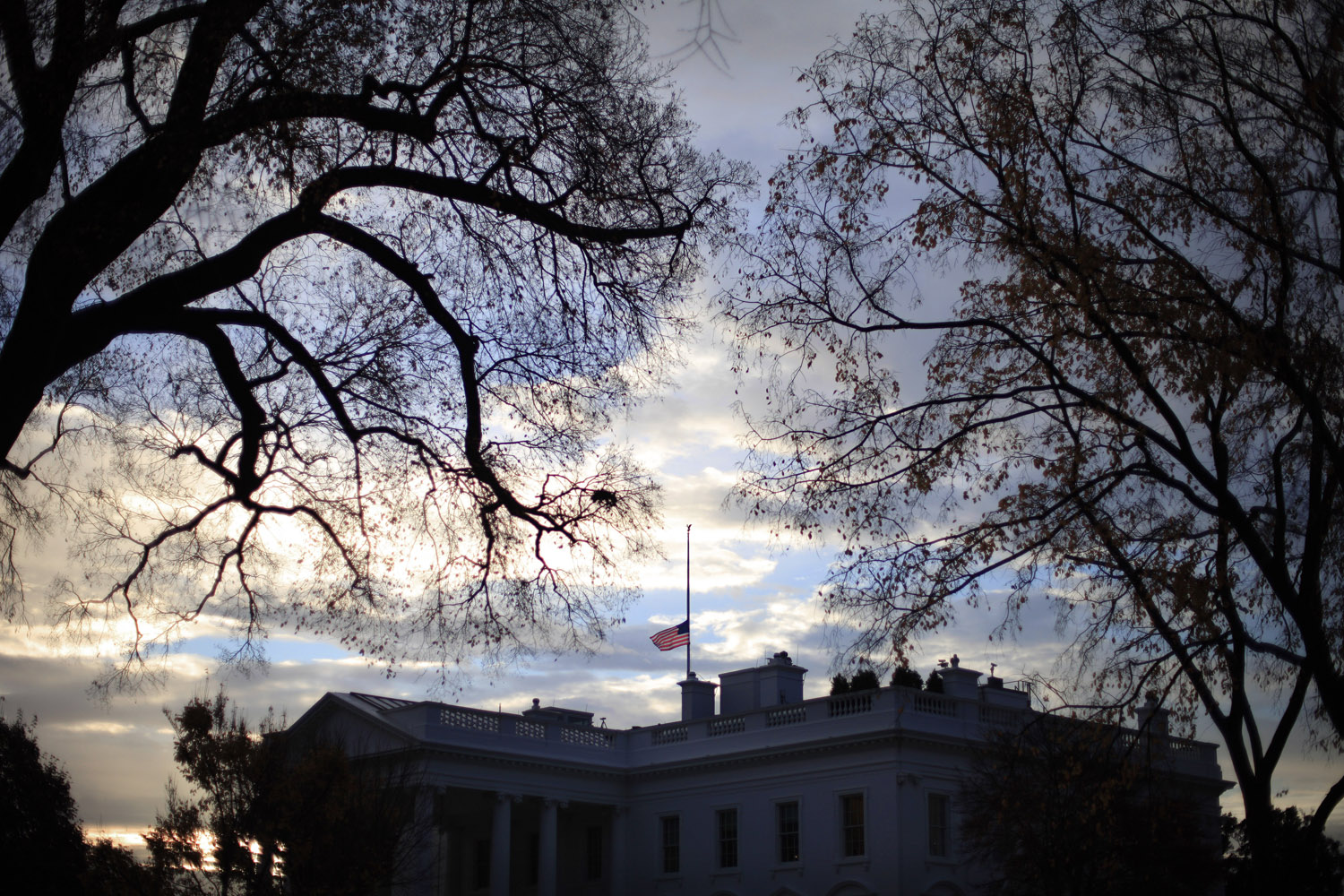 Nov. 22, 2013. A flag flies at half-staff above the White House in Washington, early Friday morning,  President Barack Obama ordered that flags be lowered at government buildings to mark the 50th anniversary of President John F. Kennedy's assassination.