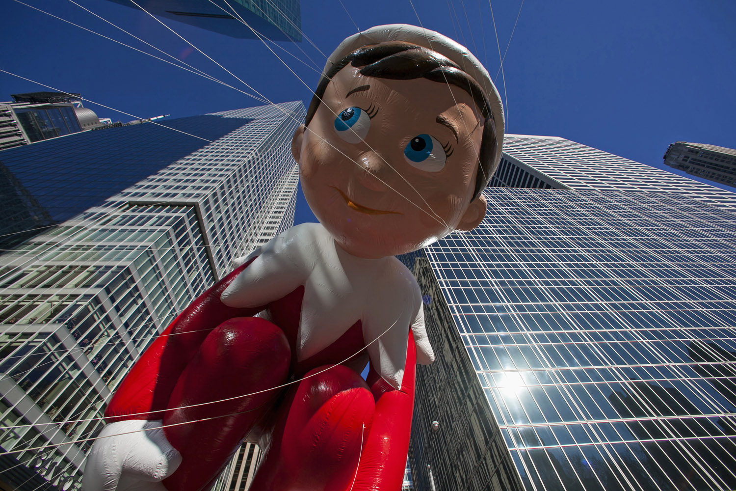 Nov. 28, 2013. The Elf on the Shelf balloon floats down Sixth Avenue during the 87th Macy's Thanksgiving Day Parade in New York.