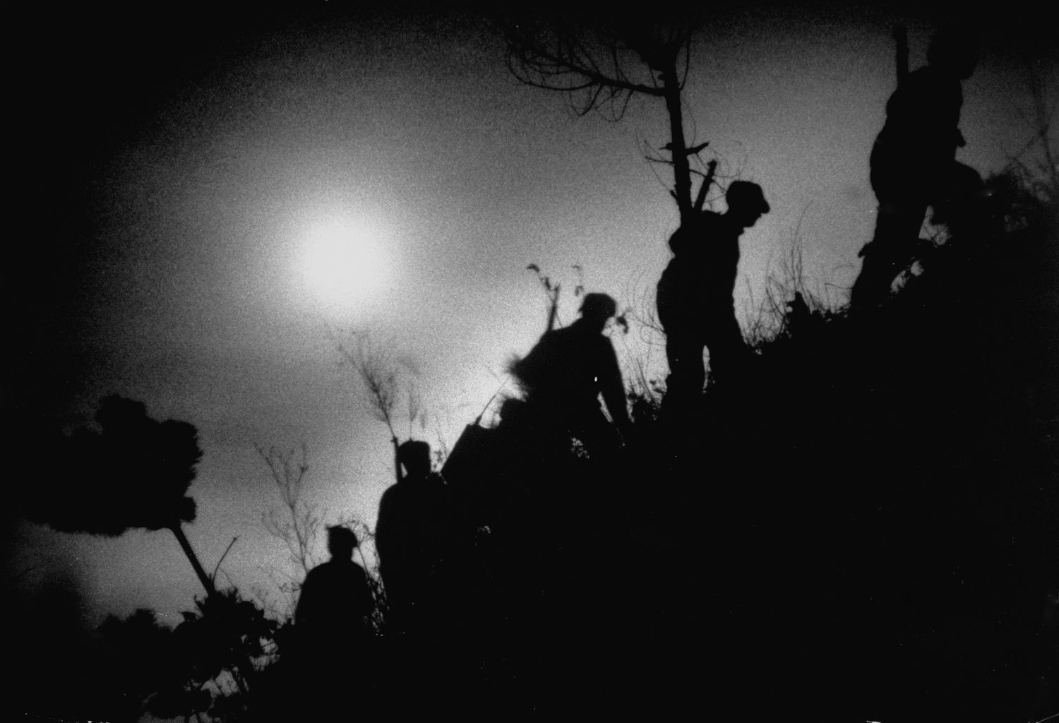 Army unit patrolling at night in Korea, 1951.