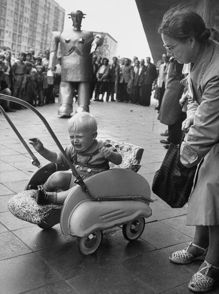 Sabor the robot frightens a baby in Hamburg, Germany, 1952.