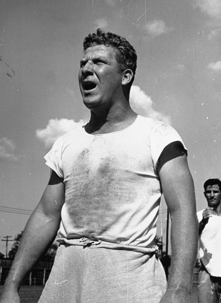 Redskins offensive lineman Henry "Red" Krause sweating in the hot sun during practice, 1938.