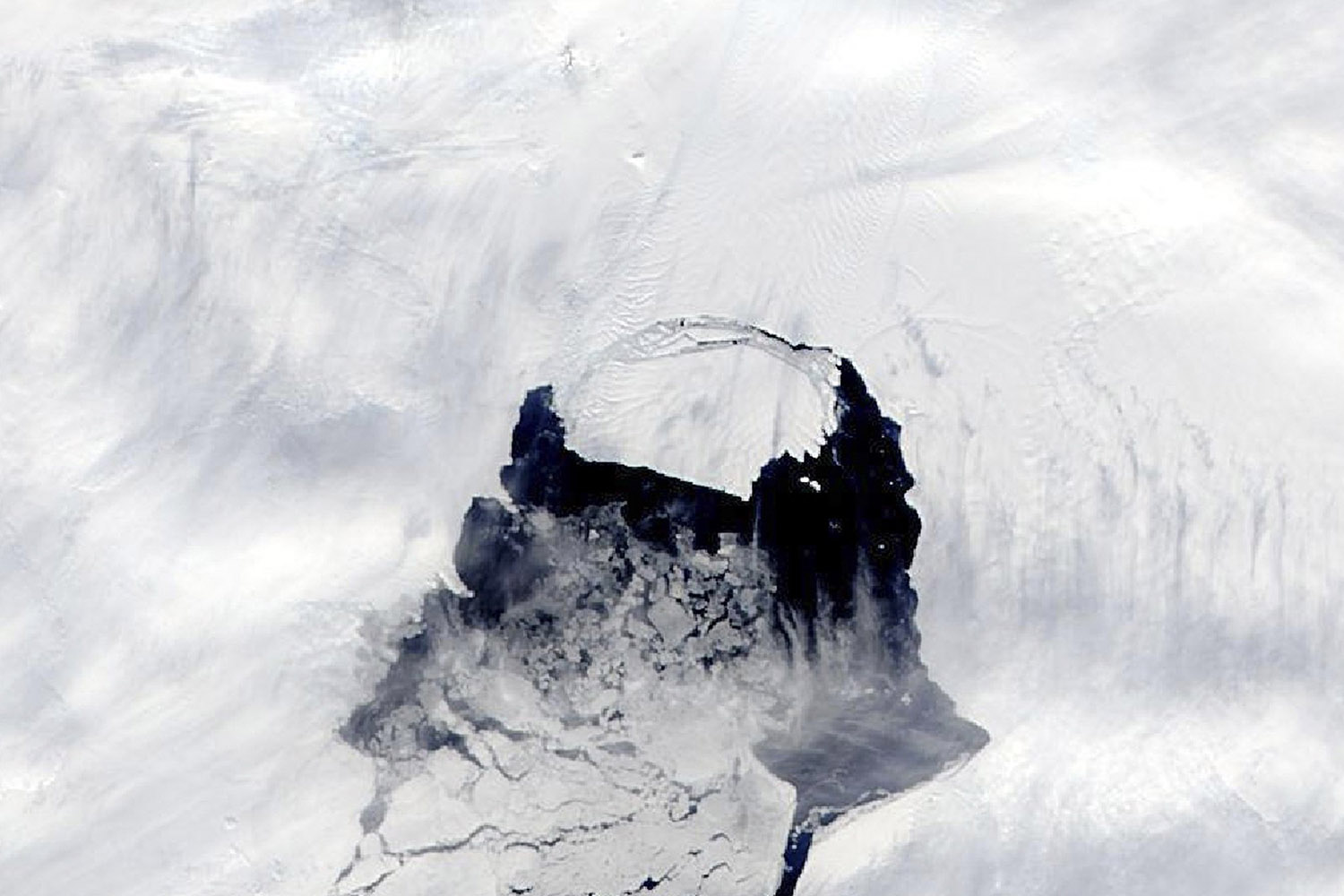 A NASA handout of an iceberg from the Pine Island Glacier separating from the Antarctica continent