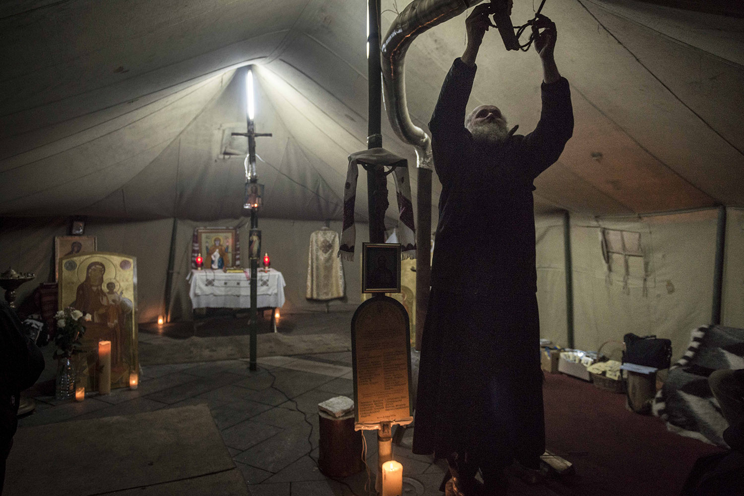 A priest maintains the prayer tent at Independence Square in Kiev, Ukraine.