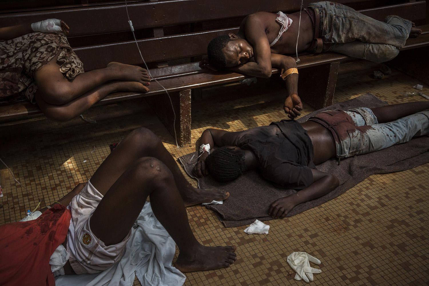 Wounded people both christians and muslims at the community hospital in Bangui. Aid workers and medical staff treated about 100 people and about 50 bodies were brought  to the hospital morgue.
