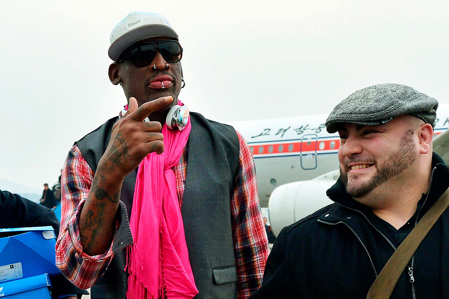 Former NBA basketball star Dennis Rodman (L) arrives at Pyongyang airport in Pyongyang, in this photo released by Kyodo Jan. 6, 2014 (Kyodo / Reuters)