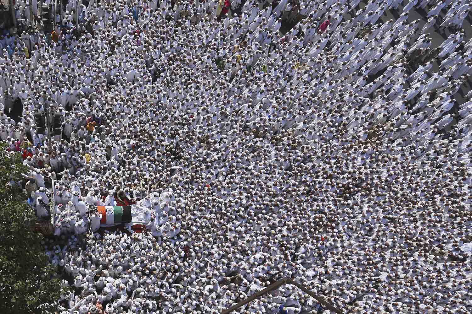 Jan. 18, 2014. Indian Dawoodi Bohra community people participate in the funeral procession of their spiritual leader Syedna Mohammed Burhanuddin, in Mumbai, India.
