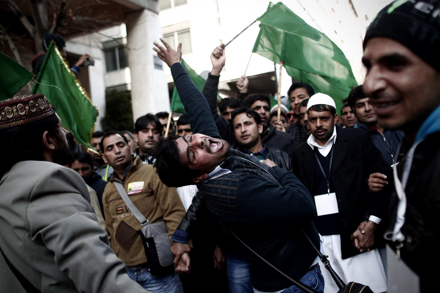 Jan. 19, 2014. Muslims living in Greece chant religious slogans during a celebration to commemorate the birth of Muslim's Prophet Muhammad (Mawlid), in Athens, Greece.