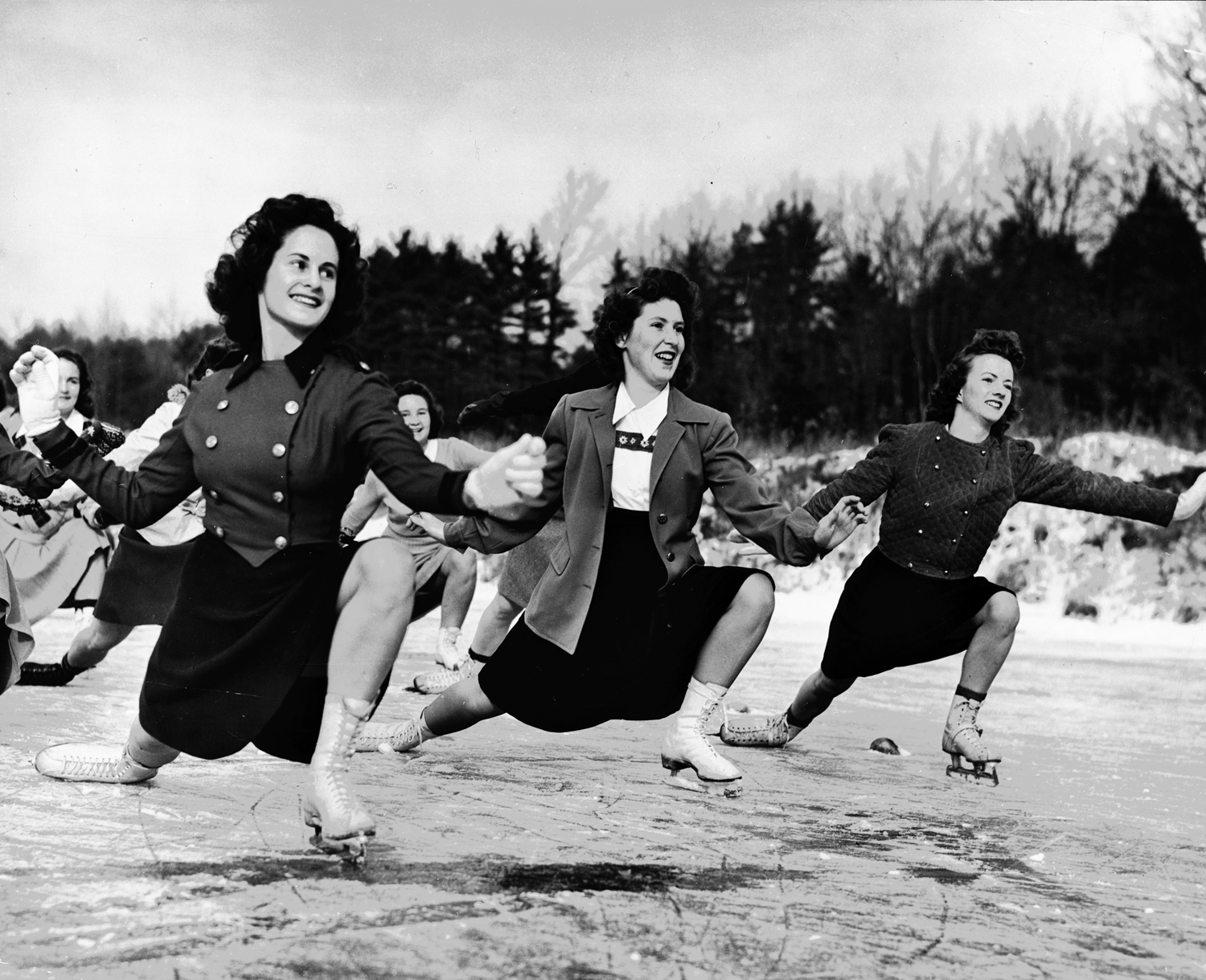 Coeds at the University of New Hampshire ice skate as part of intensive, wartime physical education program, 1942.