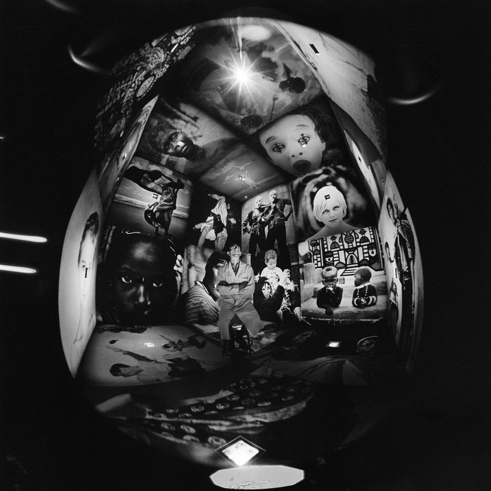 Designer Ken Isaacs sits inside his "knowledge box," 1962.