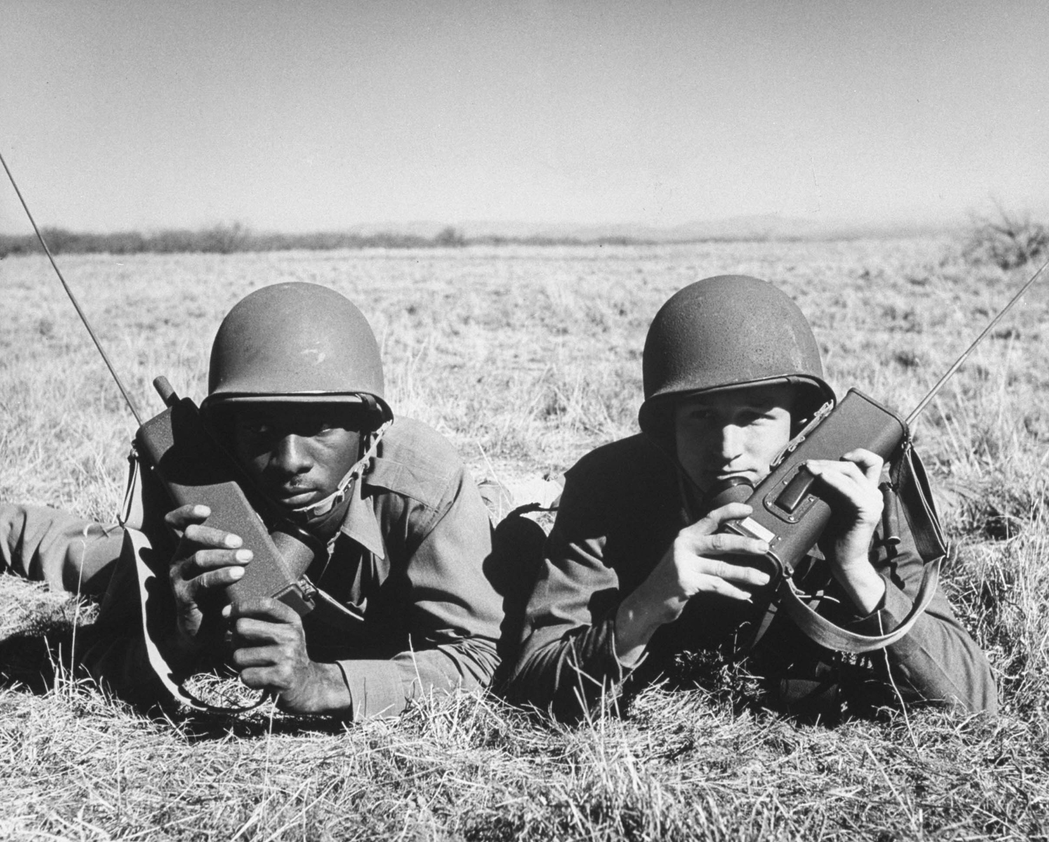Lieut. Vasco de Gama Hale (left) works with Major Thomas Simpson in directing live-ammunition practice, 1943.