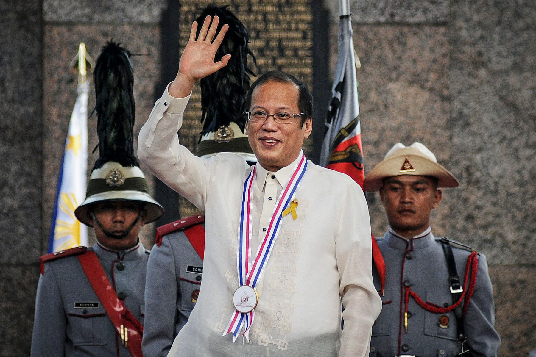 Philippine President Benigno Aquino III waves to a crowd in suburban Caloocan City, north of Manila, in November. (Ezra Acayan / NurPhoto / Sipa Press / AP)