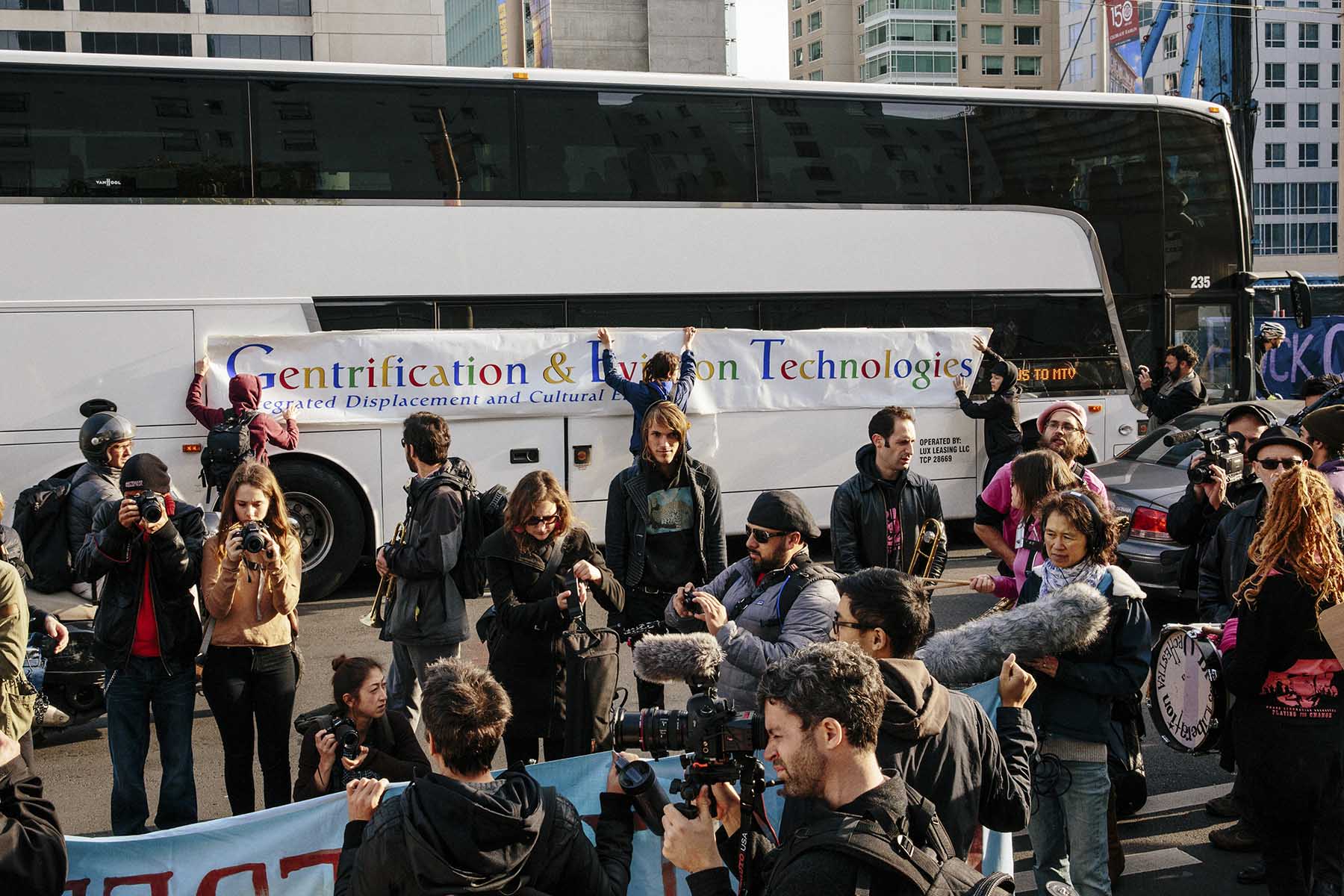 Protesters who blame tech wealth for San Francisco’s soaring housing costs blockade a private shuttle filled with Google employees. (Jake Stangel for TIME)