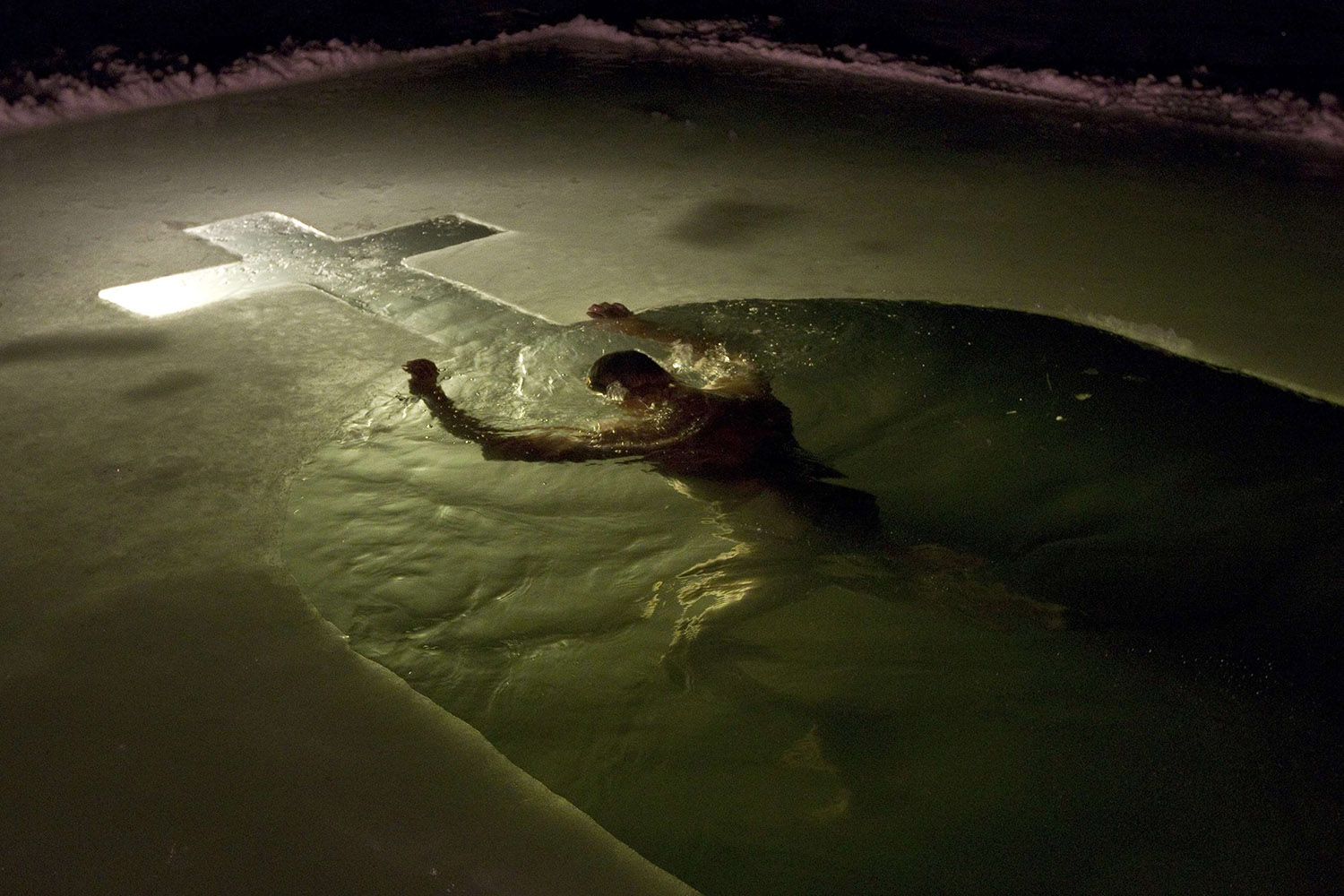 Jan. 18, 2014. A man swims in a lake in Minsk,  Orthodox believers mark Epiphany, which falls on January 19, by immersing themselves in icy waters regardless of the weather.