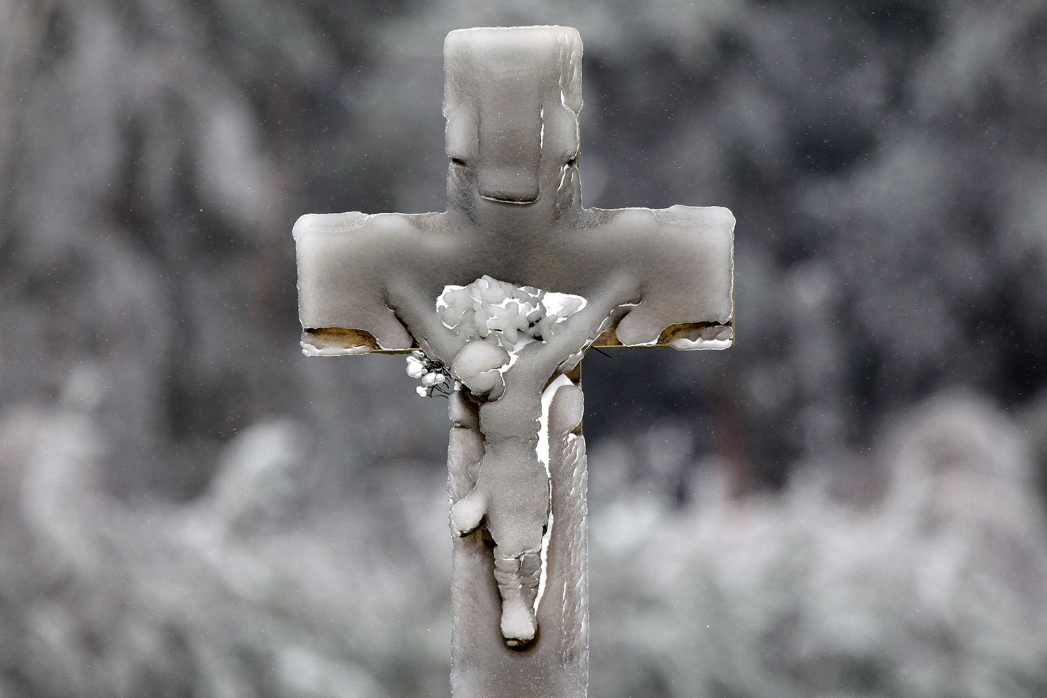 Jan. 22, 2014. A cross is covered by icicle caused by frozen rain in Alojzow near Ilza.