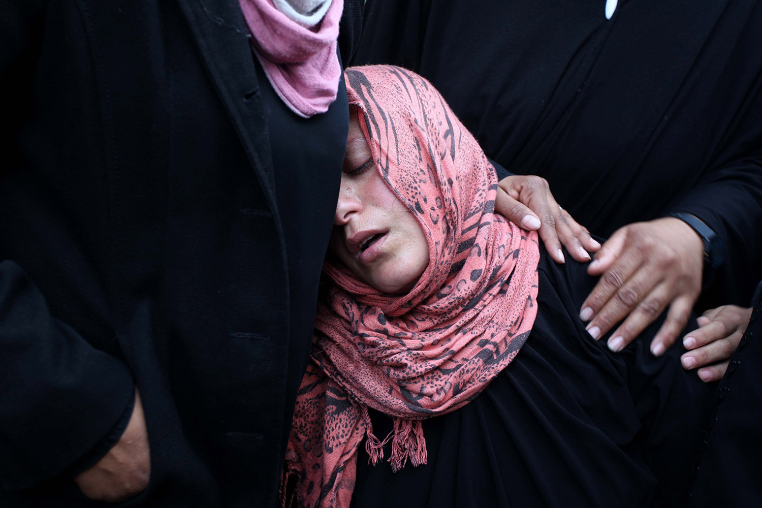 Jan. 22, 2014. Palestinian relatives of Ahmed Al-Za'anin, who was killed in an Israeli air strike, mourn during his funeral in Beit Hanoun, in the northern Gaza Strip.