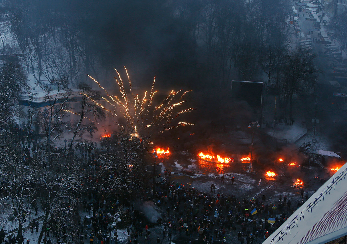 Tyres burn in the street, set alight by protesters in clashes with police in central Kiev, Jan. 22, 2014.