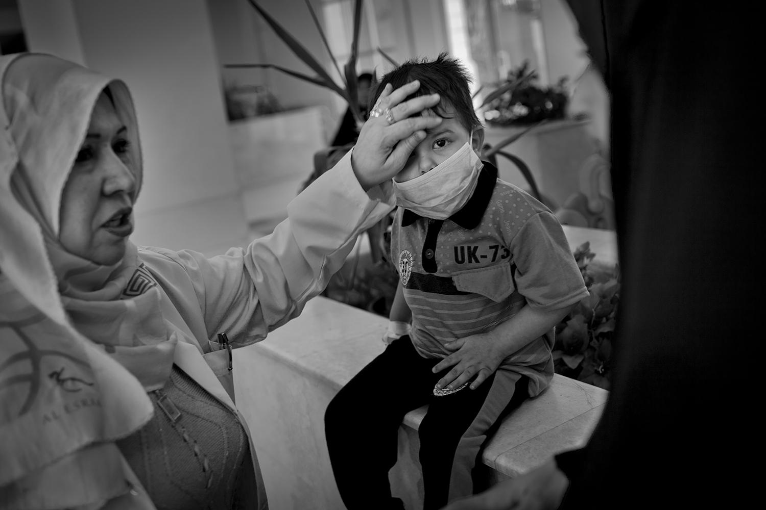 Apr. 23, 2012. Basra. An oncologist examines a young boy with cerebral tumors in the Children's Hospital.