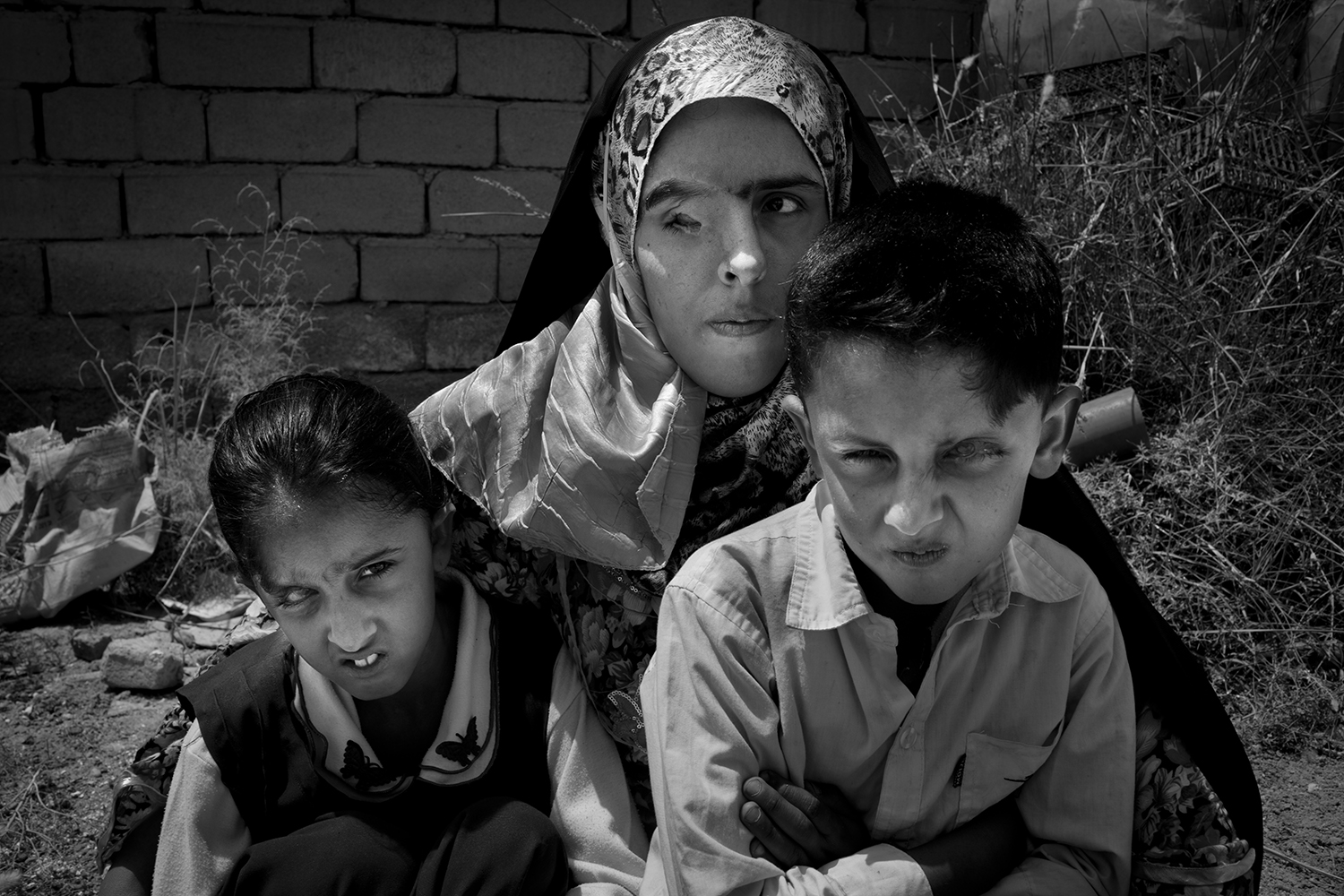 Oct. 24, 2012. Basra. Three members of one family, all of whom were were born with an eye mutation, sit for a portrait.