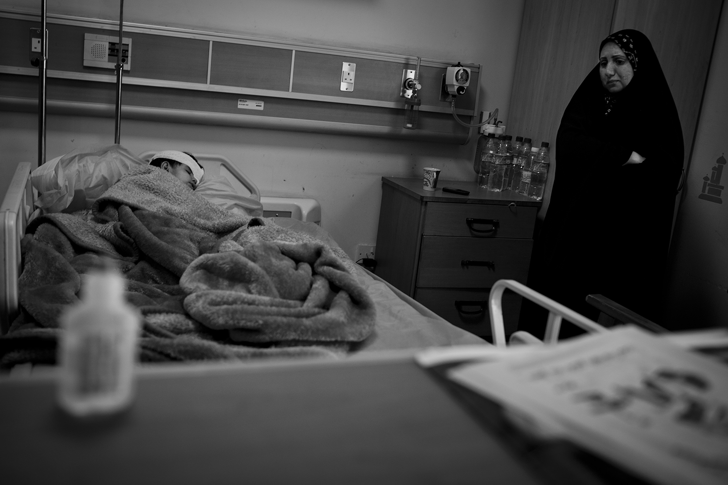 Oct. 23, 2012. Basra. A boy sick with cancer and a tumor behind an eye rests in the Children's Hospital.