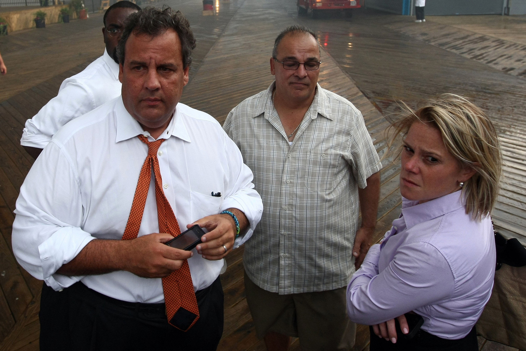 In this Sept. 12, 2013, file photo provided by the Office of the Governor of New Jersey, Deputy Chief of Staff Bridget Anne Kelly, right, stands with Gov. Chris Christie, left, during a tour of the Seaside Heights, N.J., boardwalk after it was hit by a massive fire (Office of Gov. Chris Christie /  Tim Larsen / AP)