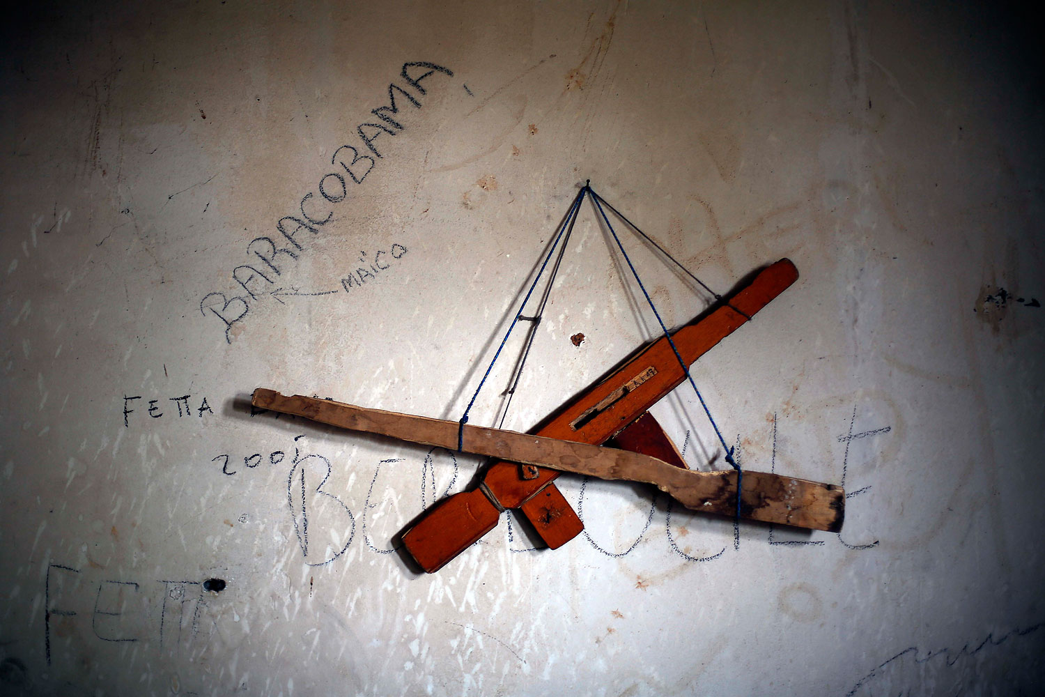 Fake wooden guns hang in Jean Bedel Bocassa's Berengo palace near Pissa, some 45 miless outh west of Bangui, Jan. 26, 2014.