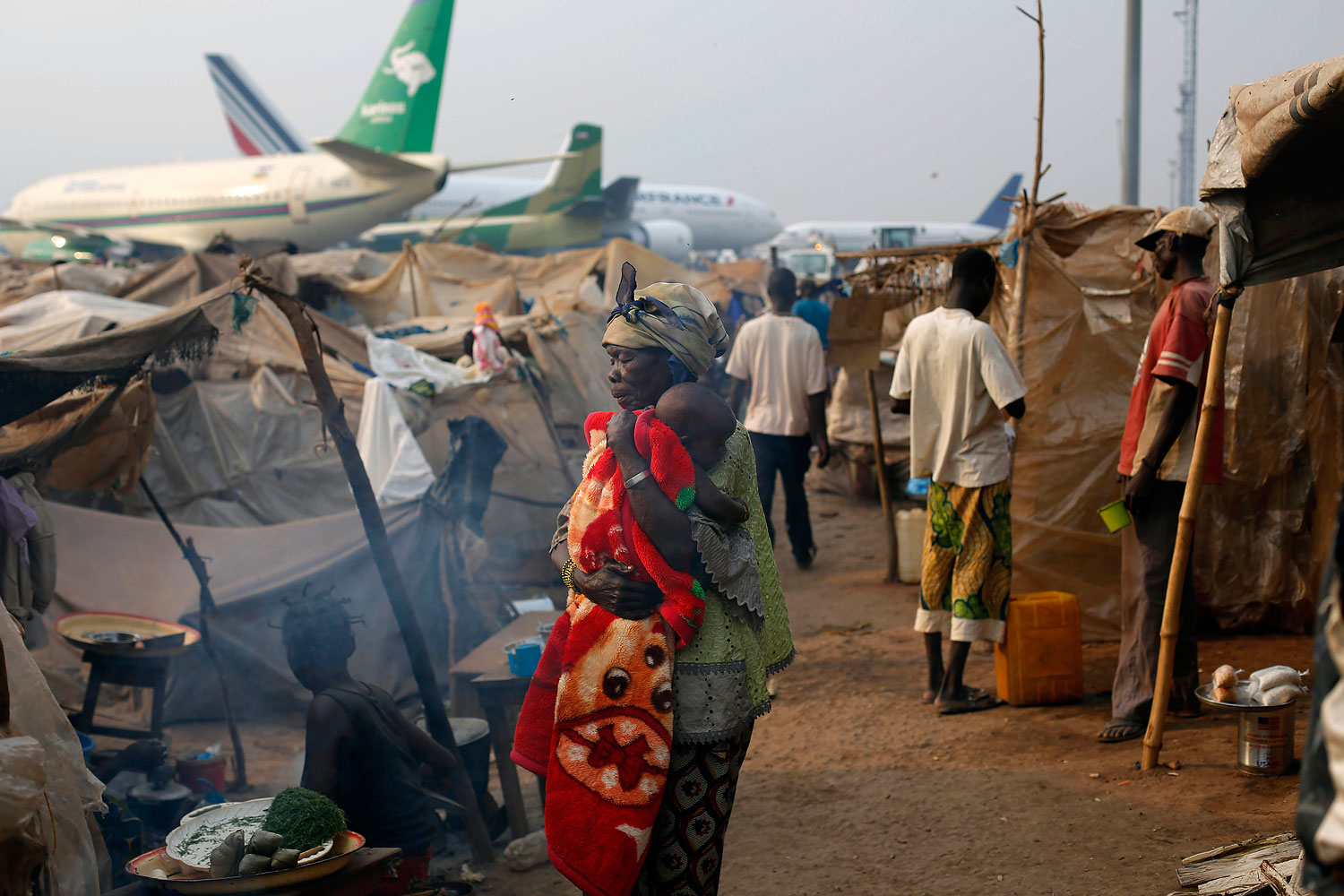 Christian refugees living in makeshift shelters near the airport in Bangui, Jan. 28, 2014, as they try to escape from the deepening divisions between the country's Muslim minority and Christian majority.