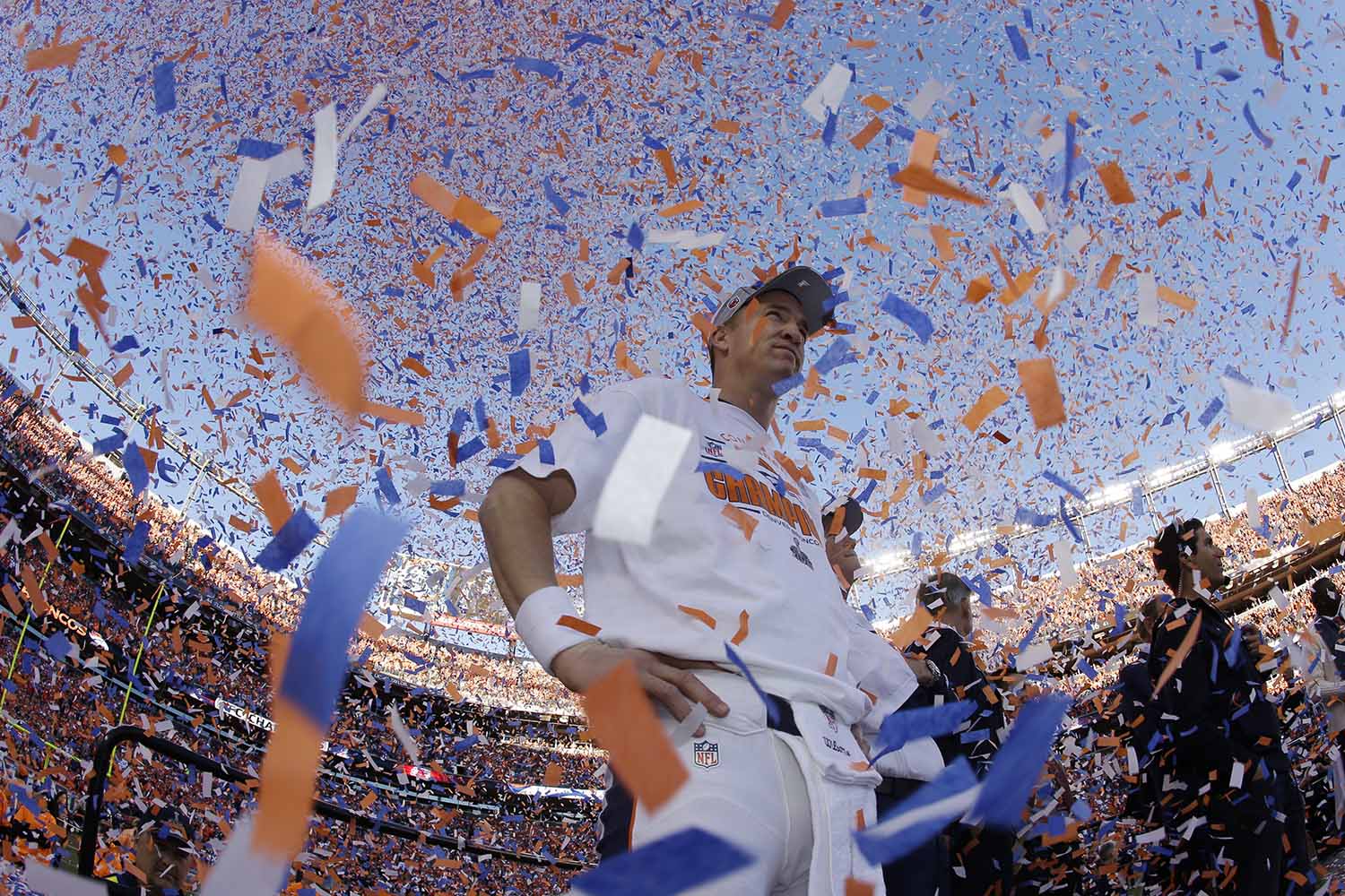 Jan. 19, 2014. Denver Broncos quarterback Peyton Manning is engulfed in confetti during the trophy ceremony after the AFC Championship NFL playoff football game in Denver, Col.