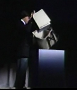 Steve Jobs removes the Mac from its case at the BCS meeting (Computer History Museum)