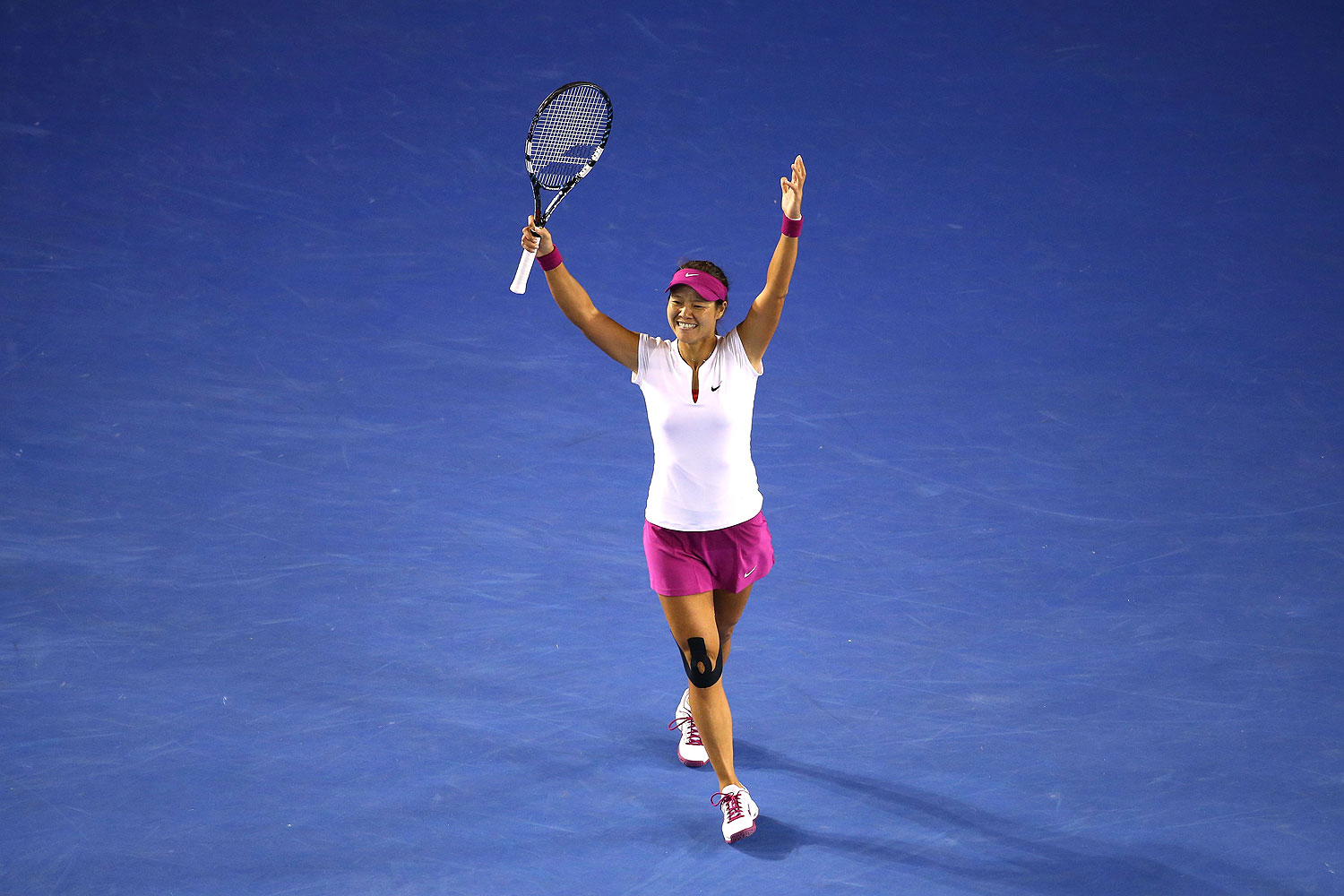 Li Na of China celebrates winning the Australian Open in Melbourne on Jan. 25, 2014 (Quinn Rooney / Getty Images)