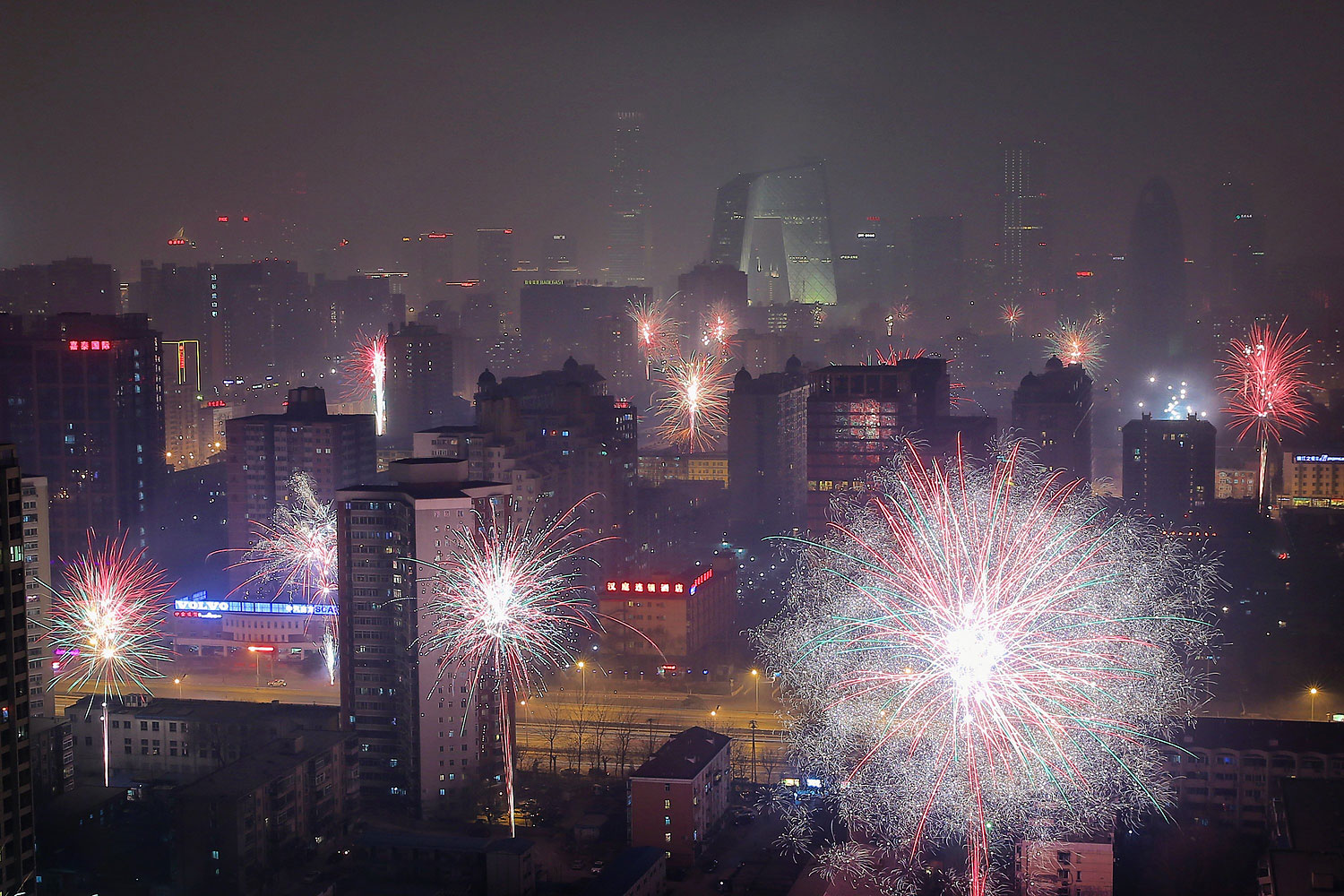 Fireworks illuminate the skyline to celebrate Chinese Lunar New Year of Horse and cause severe air pollution on Jan. 30, 2014 in Beijing.